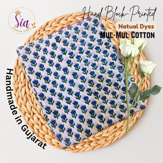 Hand block-printed beauty features delicate indigo flowers and emerald green geometric borders on the softest mul-mul cotton — dyed using natural colors and handmade with devotion in Gujarat. - Sia Premium Fabric
