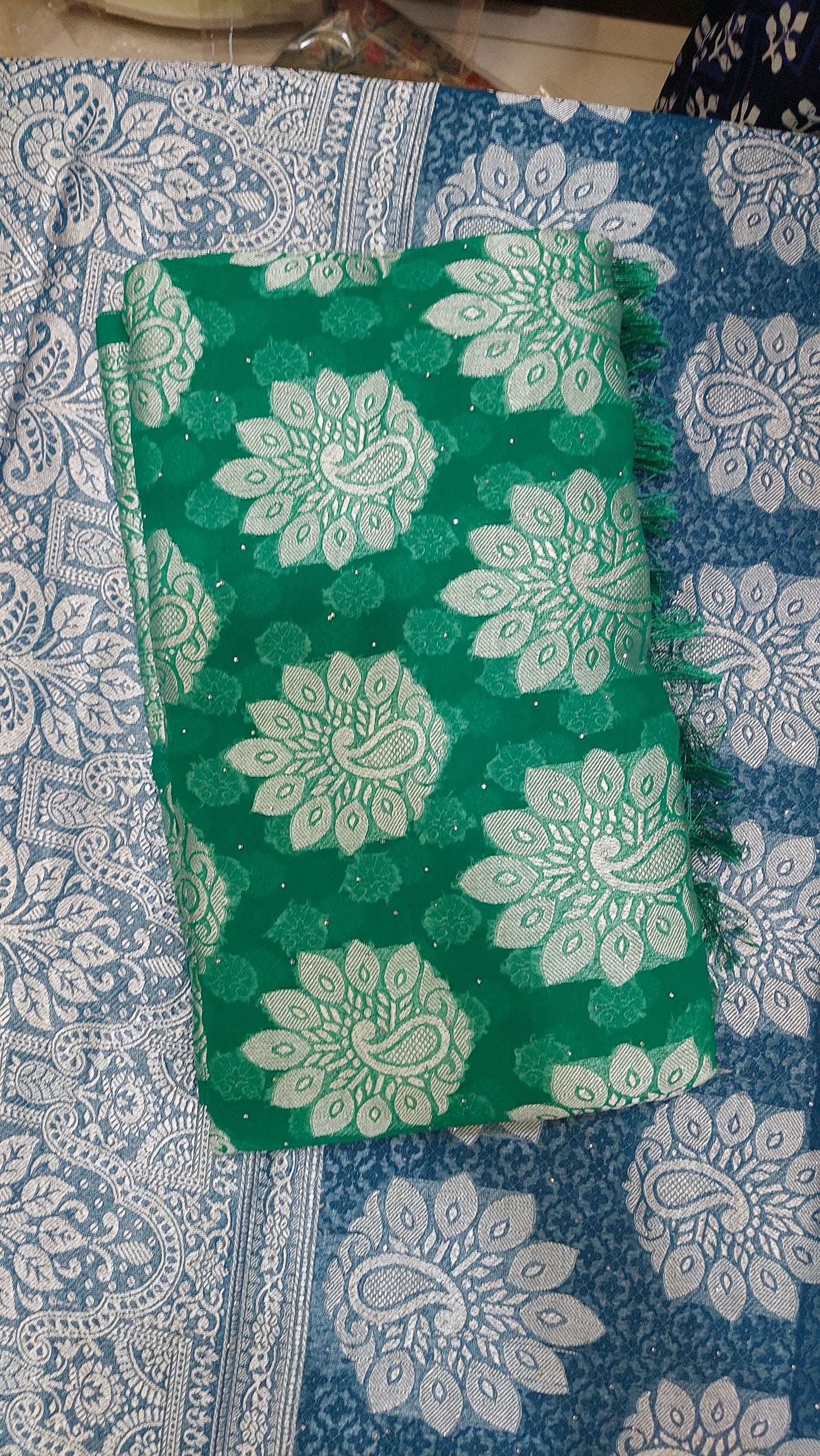 Green chiffon brasso saree with Peackock motifs and Heavy Zari Border - Sia Premium Fabric
