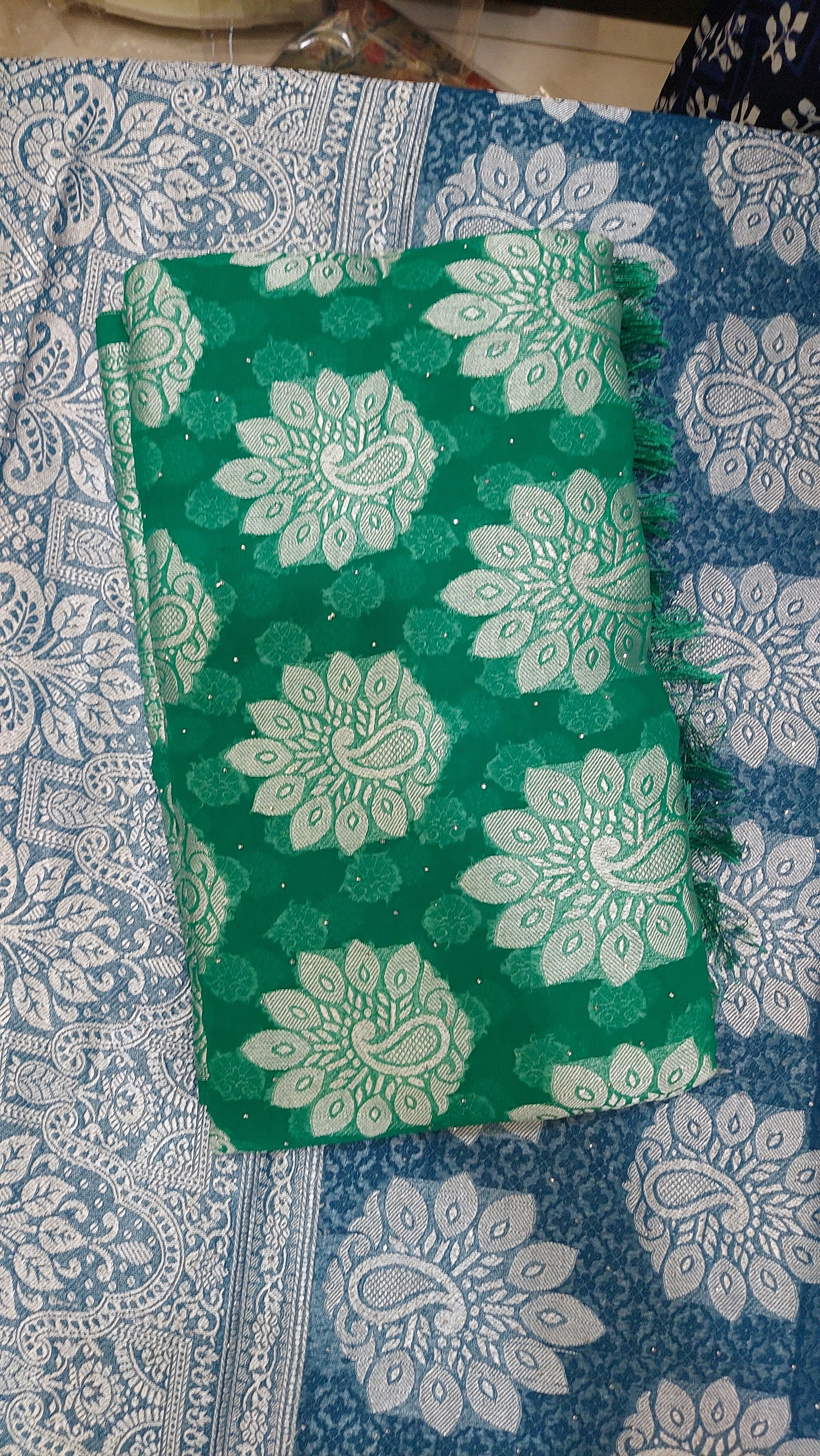 Green chiffon brasso saree with Peackock motifs and Heavy Zari Border - Sia Premium Fabric