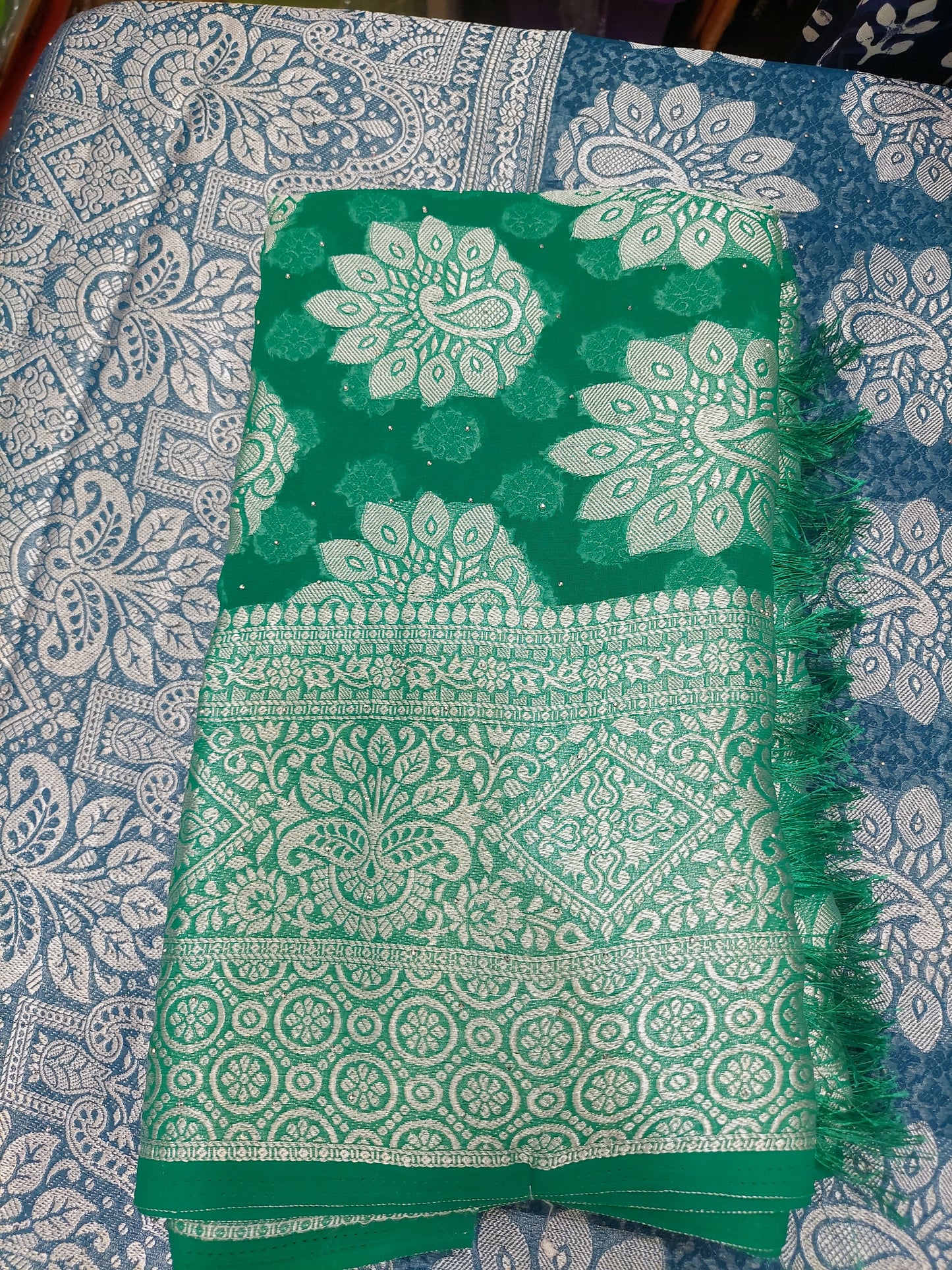 Green chiffon brasso saree with Peackock motifs and Heavy Zari Border - Sia Premium Fabric