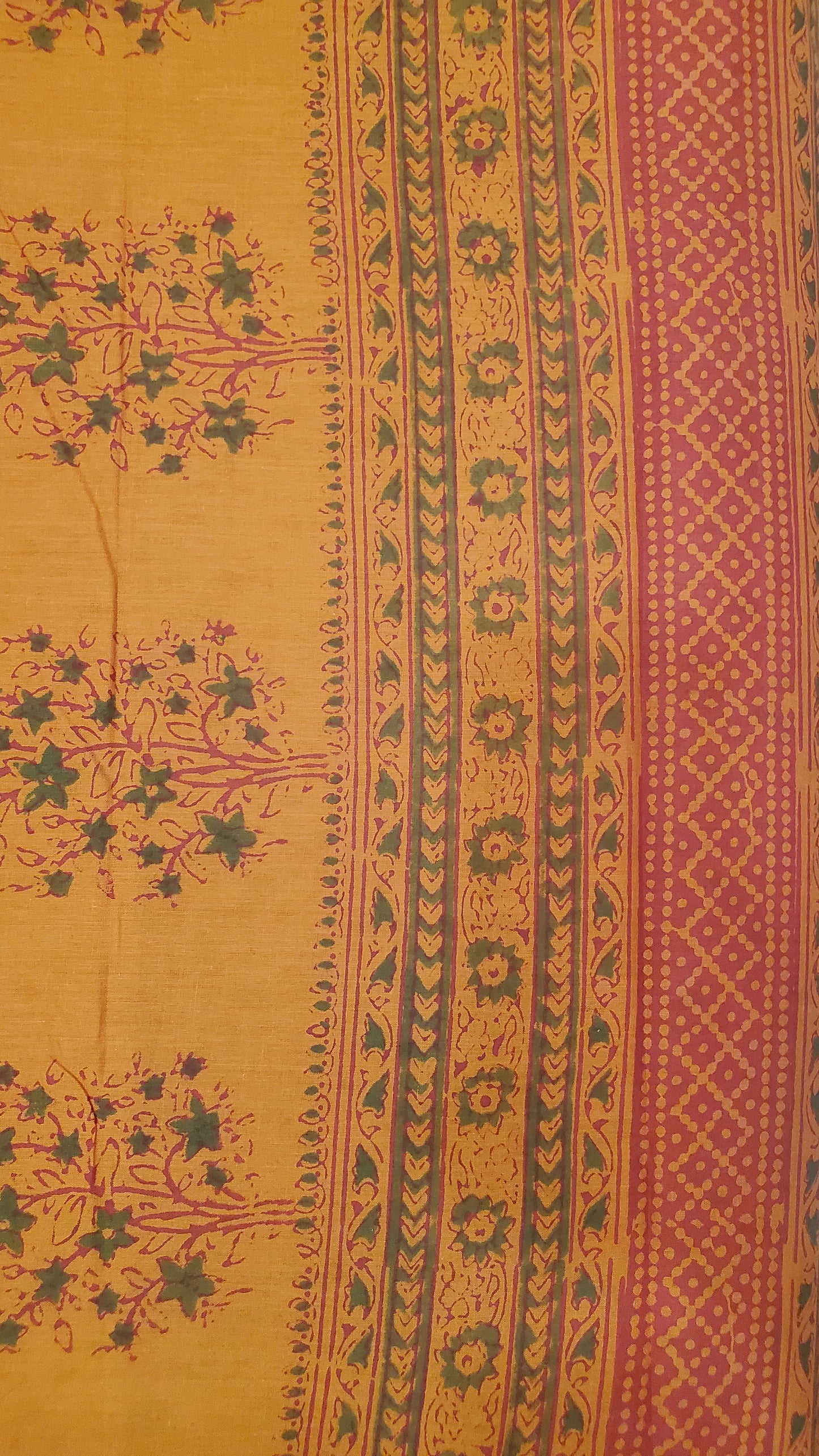 Rust orange beauty features classic hand block floral motifs and intricate borders