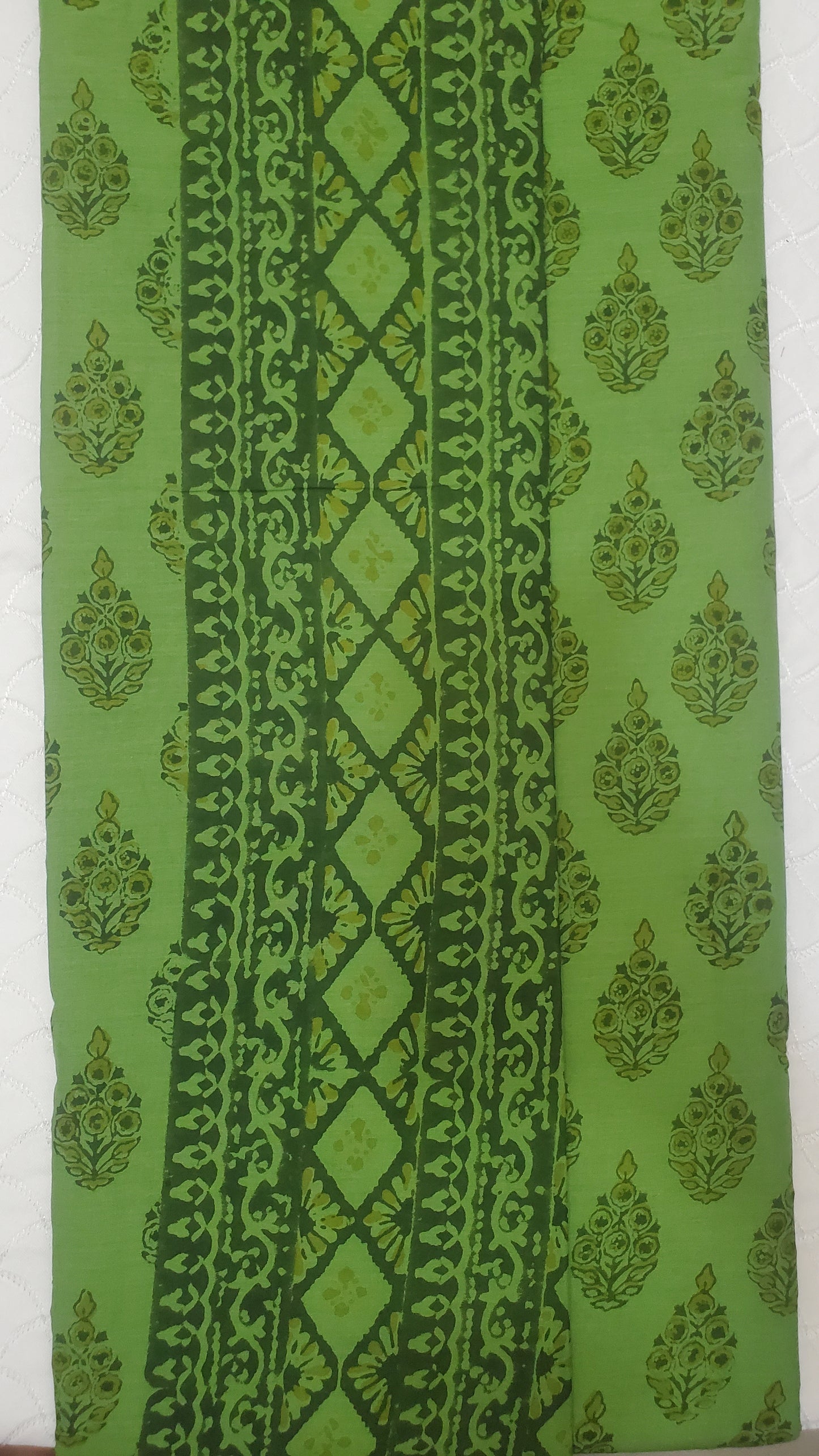 Lush green saree with intricate floral motifs