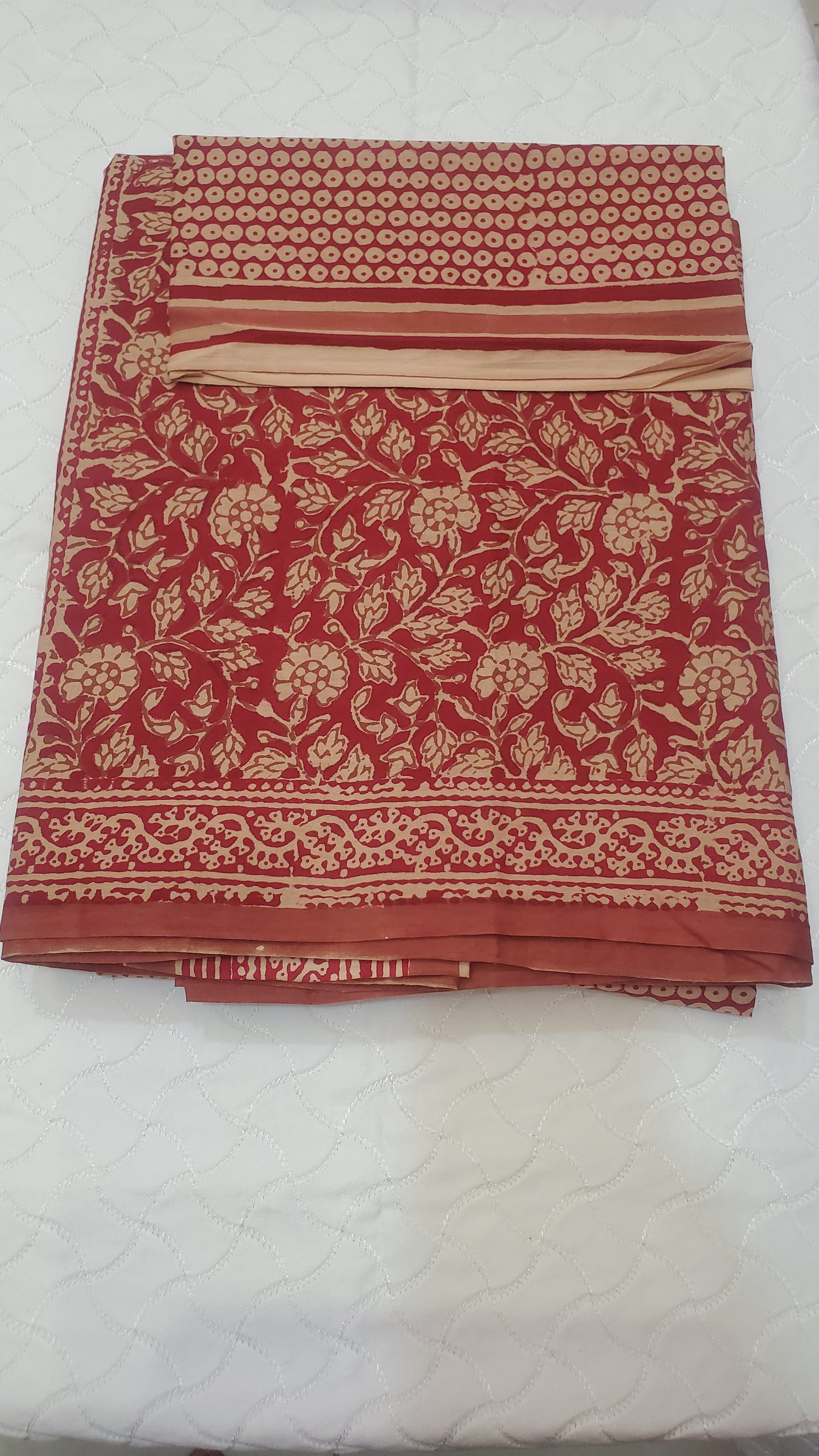 Deep red, adorned with intricate floral block prints