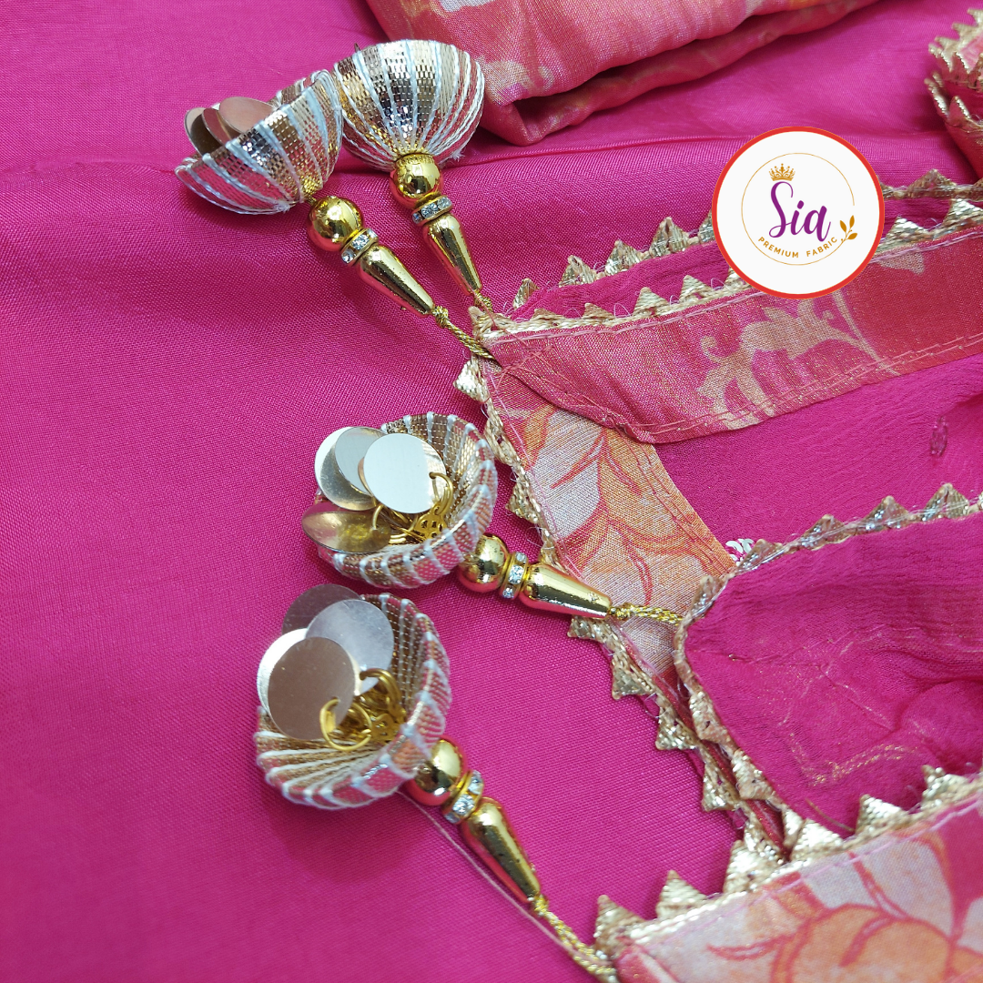 Premium Pure Organza with Handwork in a vibrant Fuchsia Pink, enhanced with delicate floral prints.