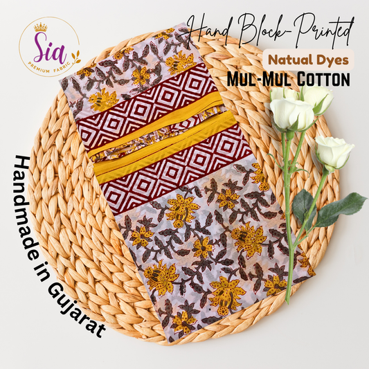 Striking blend of geometric maroon patterns with vibrant yellow floral handblock prints on soft mul-mul cotton - Sia Premium Fabric