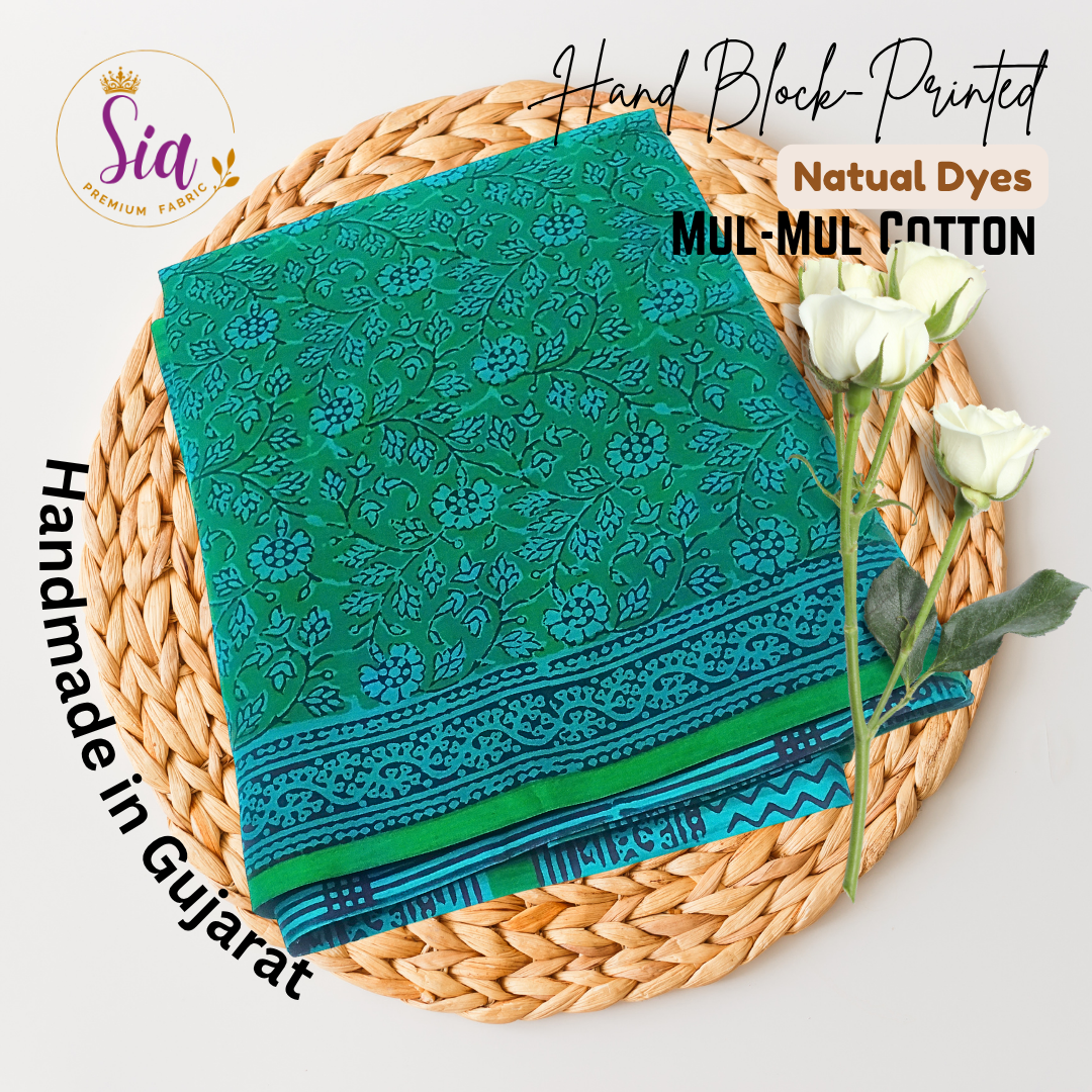 Vibrant green saree with intricate floral block prints in deep indigo tones