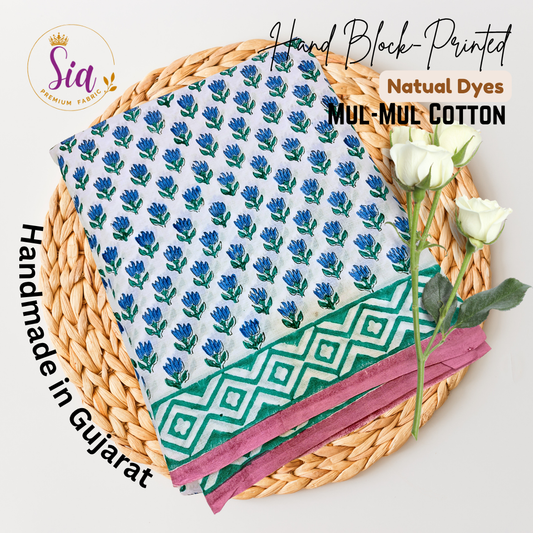 Hand block-printed beauty features delicate indigo flowers and emerald green geometric borders on the softest mul-mul cotton — dyed using natural colors and handmade with devotion in Gujarat. - Sia Premium Fabric
