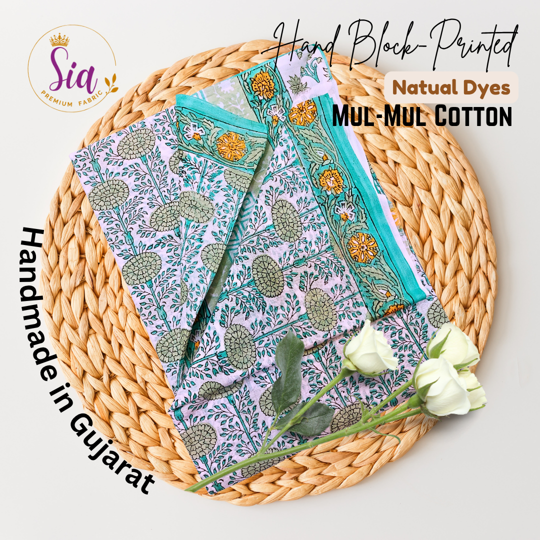 Floral vines in sage green and teal, hand block-printed on breathable mul-mul cotton, is a celebration of craft and culture - Sia Premium Fabric
