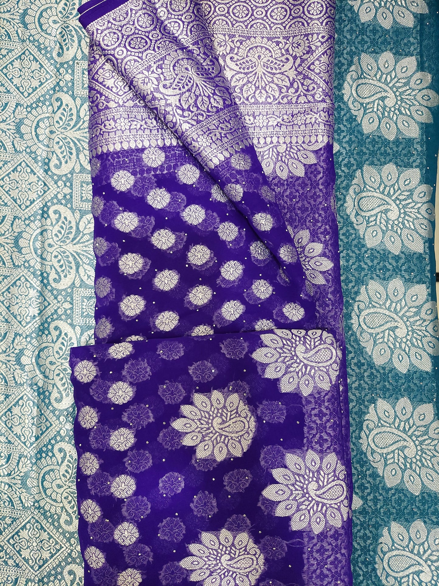Purple chiffon brasso saree with Peacock motifs and Heavy Zari Border - Sia Premium Fabric