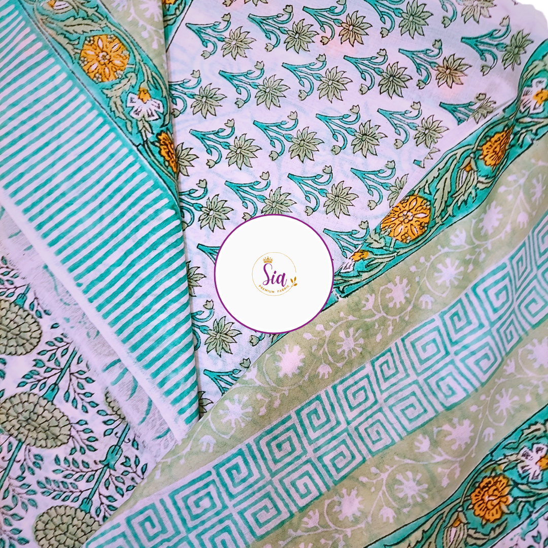 Floral vines in sage green and teal, hand block-printed on breathable mul-mul cotton, is a celebration of craft and culture - Sia Premium Fabric