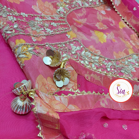 Premium Pure Organza with Handwork in a vibrant Fuchsia Pink, enhanced with delicate floral prints.